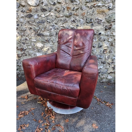 1094 - A red leather revolving occasional chair.