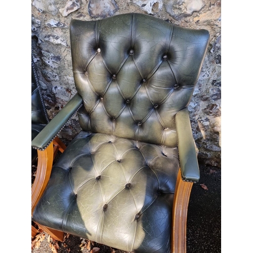 1108 - A pair of reproduction green buttoned leather and beech Gainsborough chairs.