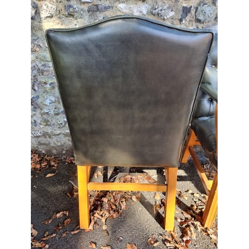 1108 - A pair of reproduction green buttoned leather and beech Gainsborough chairs.