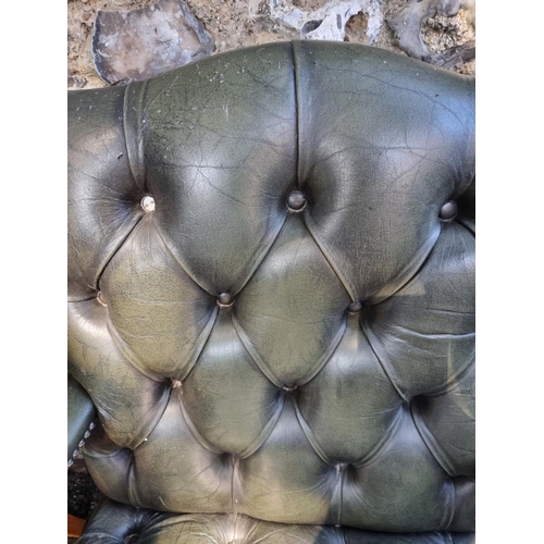 1108 - A pair of reproduction green buttoned leather and beech Gainsborough chairs.