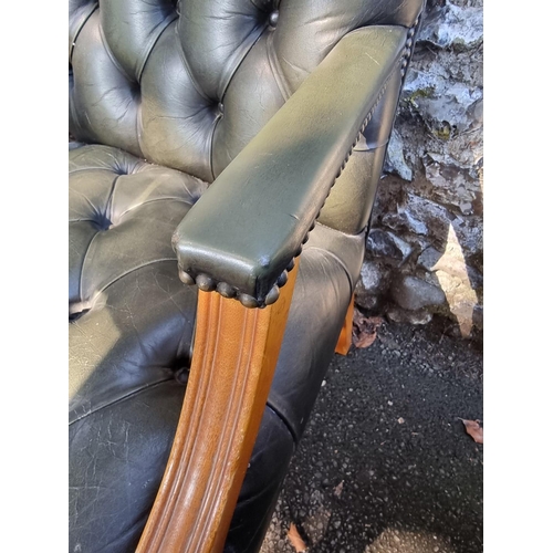 1108 - A pair of reproduction green buttoned leather and beech Gainsborough chairs.