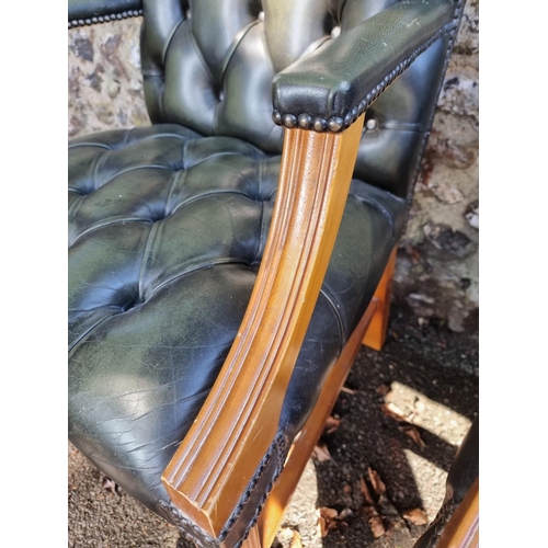 1108 - A pair of reproduction green buttoned leather and beech Gainsborough chairs.