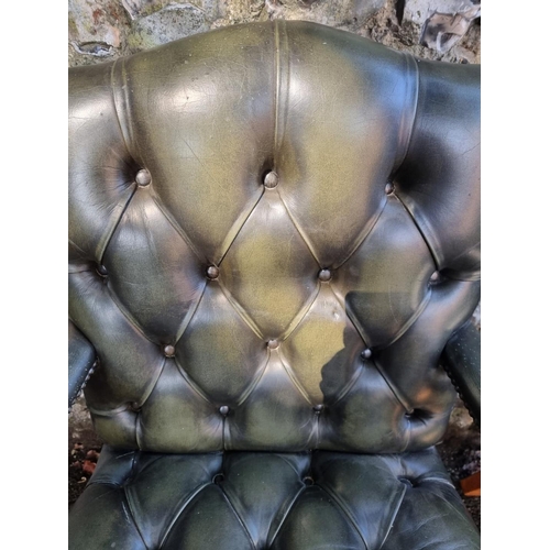 1108 - A pair of reproduction green buttoned leather and beech Gainsborough chairs.