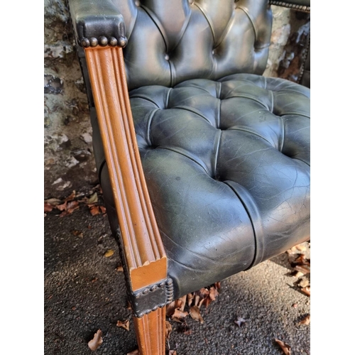 1108 - A pair of reproduction green buttoned leather and beech Gainsborough chairs.