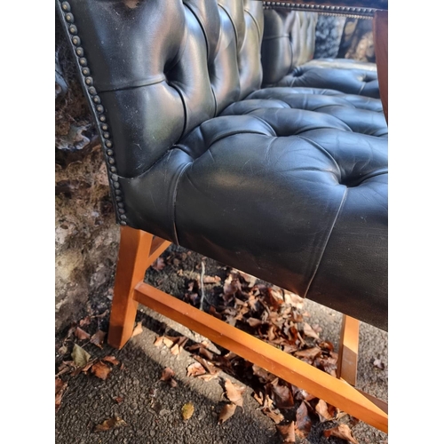 1108 - A pair of reproduction green buttoned leather and beech Gainsborough chairs.