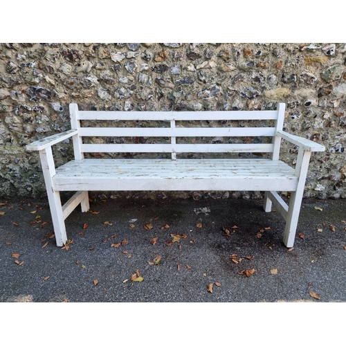 1111 - A white painted garden bench, 180cm wide.