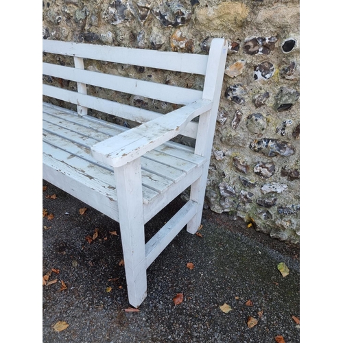 1111 - A white painted garden bench, 180cm wide.