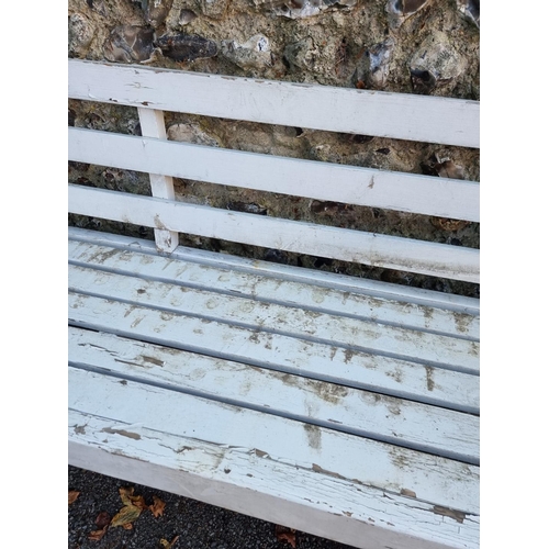 1111 - A white painted garden bench, 180cm wide.