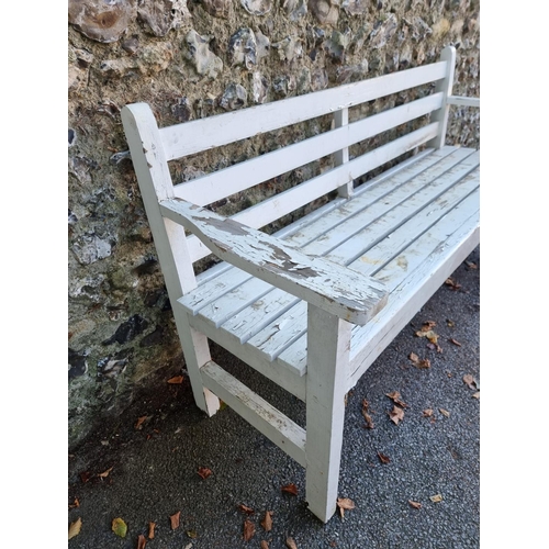 1111 - A white painted garden bench, 180cm wide.