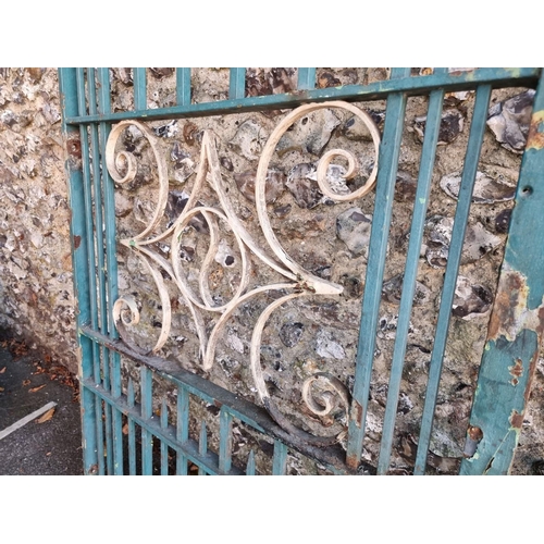 1112 - An old pair of painted wrought iron gates, 197cm x 214cm; together with another smaller matching gat... 