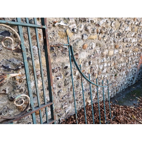 1112 - An old pair of painted wrought iron gates, 197cm x 214cm; together with another smaller matching gat... 