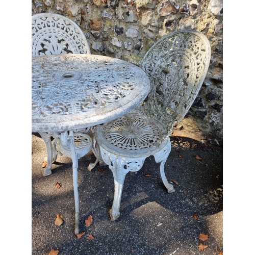 1117 - Two white painted aluminium circular garden tables and four chairs, the table 69cm diameter.... 