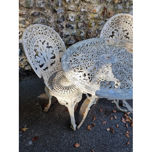 1117 - Two white painted aluminium circular garden tables and four chairs, the table 69cm diameter.... 