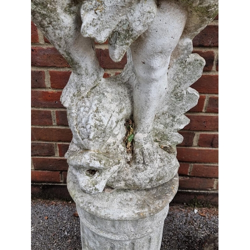 1121 - A pair of old painted and weathered composition stone cherub and dolphin figures, on pedestals, 128c... 