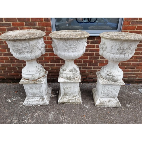 1122 - A large set of three white painted and weathered composition stone Campana urns and pedestals, ... 