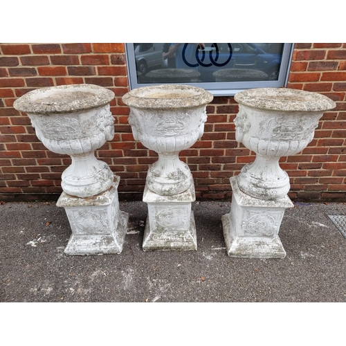 1122 - A large set of three white painted and weathered composition stone Campana urns and pedestals, ... 