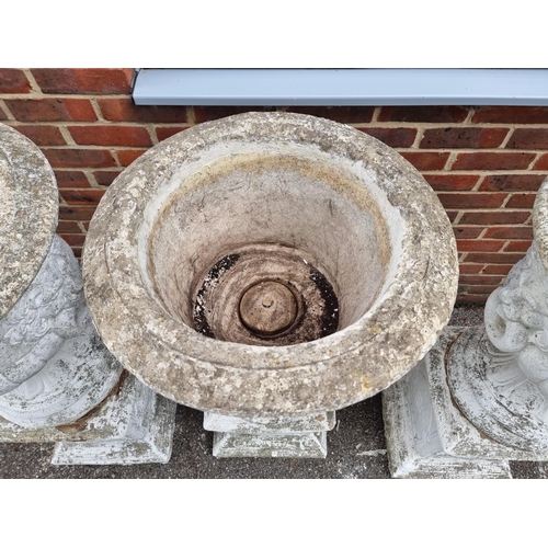 1122 - A large set of three white painted and weathered composition stone Campana urns and pedestals, ... 