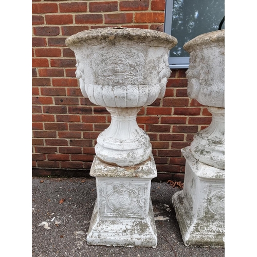 1122 - A large set of three white painted and weathered composition stone Campana urns and pedestals, ... 