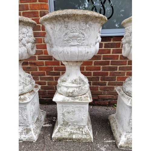 1122 - A large set of three white painted and weathered composition stone Campana urns and pedestals, ... 