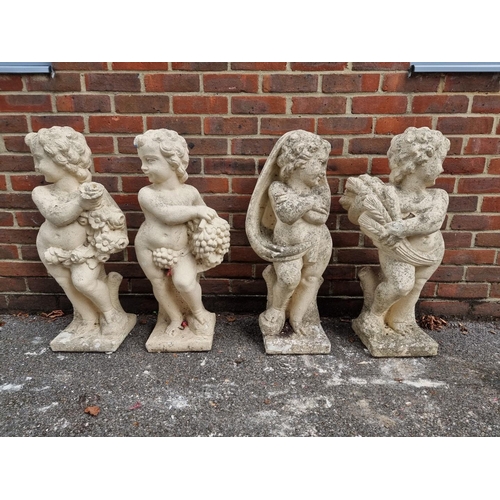 1123 - A set of four painted and weathered stone figures, emblematic of The Seasons, 80cm high.... 