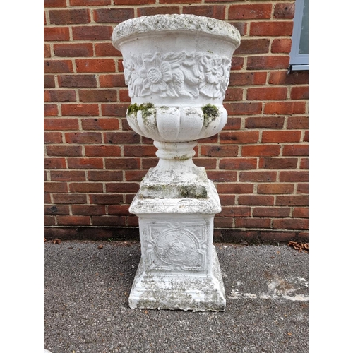 1124 - A white painted composition stone Campana urn and pedestal, 110cm high.