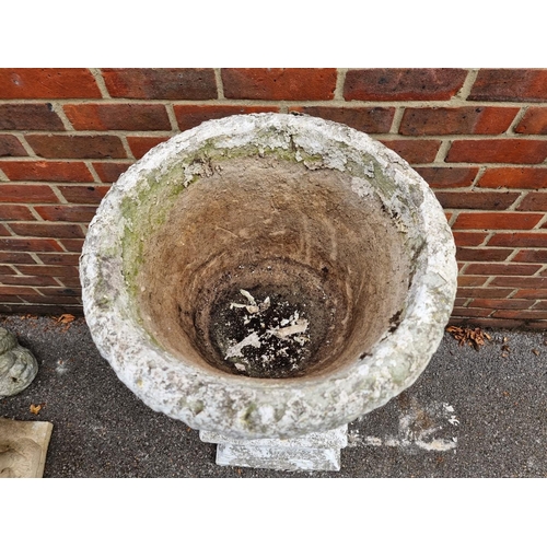 1124 - A white painted composition stone Campana urn and pedestal, 110cm high.