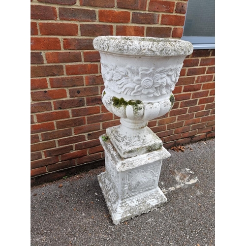 1124 - A white painted composition stone Campana urn and pedestal, 110cm high.