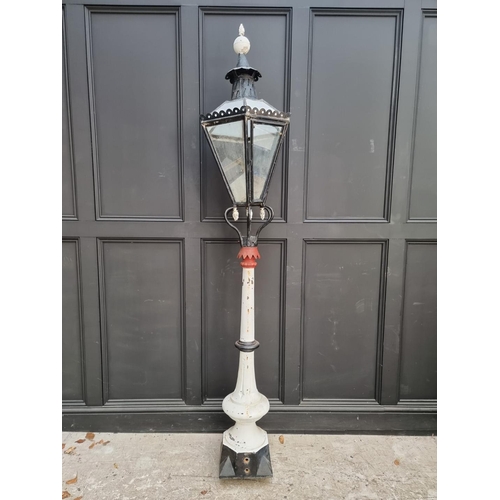 1125 - An old painted cast iron street lamp, 220cm high.