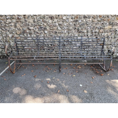 1127 - A large wrought iron garden bench, 243cm wide. 