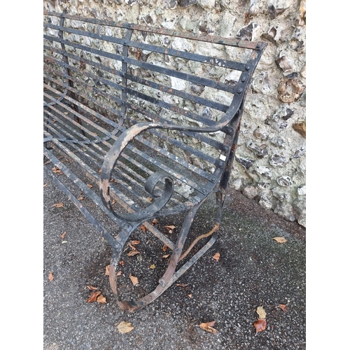 1127 - A large wrought iron garden bench, 243cm wide. 