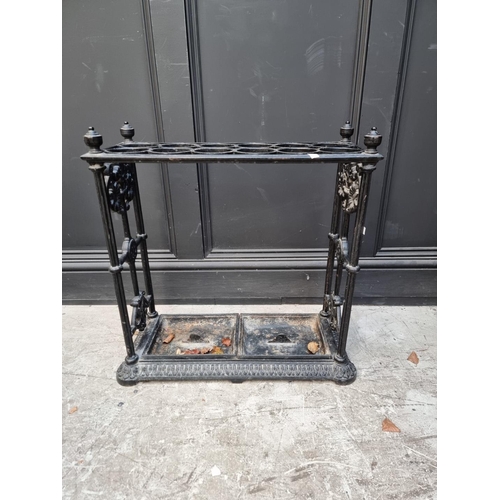 1133 - A large old cast iron stick stand, 63cm wide.