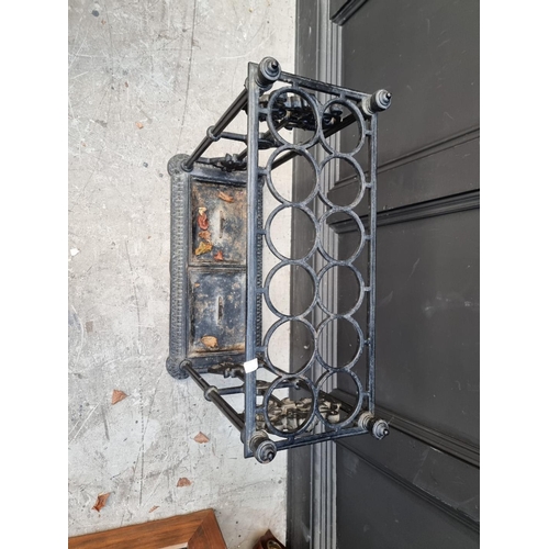 1133 - A large old cast iron stick stand, 63cm wide.