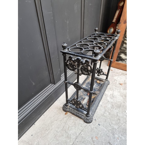 1133 - A large old cast iron stick stand, 63cm wide.