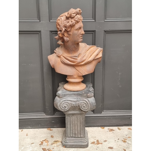 1137 - After the Antique, a large cast iron bust of Apollo, 78cm high, on a painted terracotta io... 