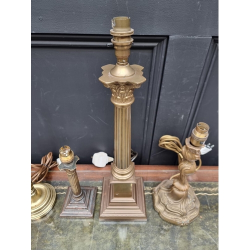 1158 - Four brass table lamps, to include two Corinthian column examples, total height of largest 48cm.... 