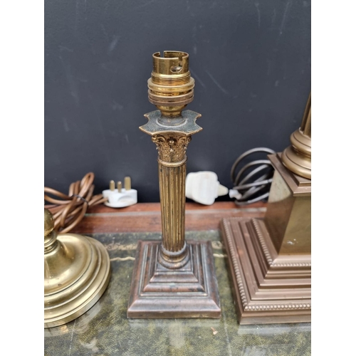 1158 - Four brass table lamps, to include two Corinthian column examples, total height of largest 48cm.... 