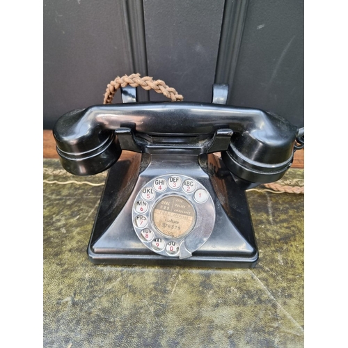 1161 - An old black Bakelite telephone, by S B & Co Ltd. 