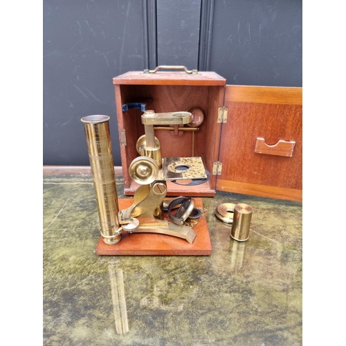 1162 - An antique brass microscope, by Stanley, in mahogany case.  