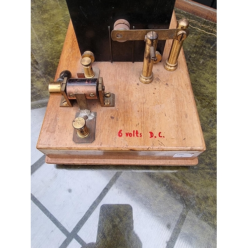 1183 - An old induction coil, 39cm wide; together with an old spit jack mechanism.