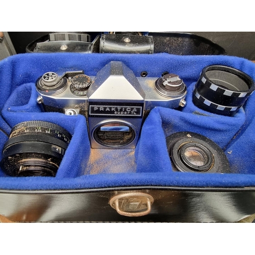 1189 - Cameras: a Praktica Super TL body; a Praktica MTL3 body; lenses, cases, etc. ... 