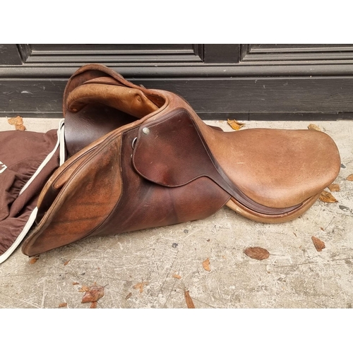 1199 - Equestrian: a leather saddle, by Frederic Butet, Saumur, with conforming dust cover. ... 