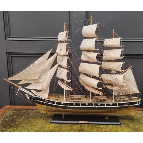 1200 - A painted wood model of The Cutty Sark, total length 88cm.