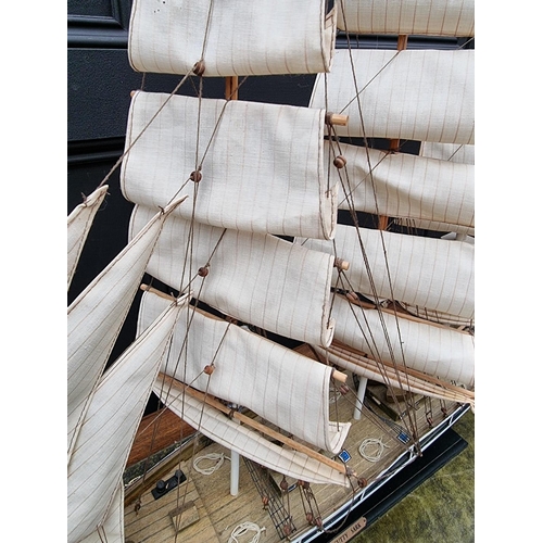 1200 - A painted wood model of The Cutty Sark, total length 88cm.