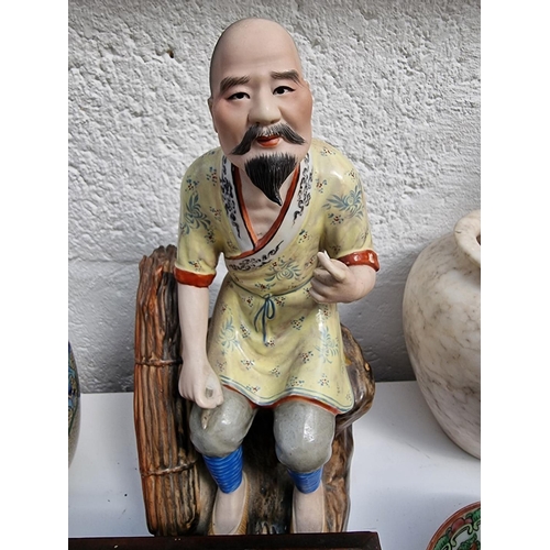 1210 - A mixed group of Chinese and Japanese ceramics and works of art, to include a figure, 24.5cm high.... 