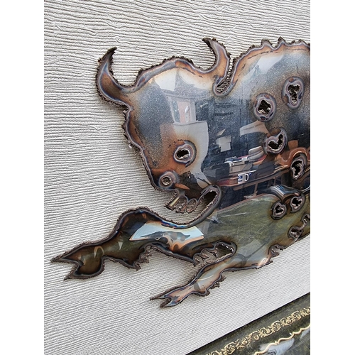 1149 - A sheet metal bull, on mount, the whole 43 x 68.5cm. 