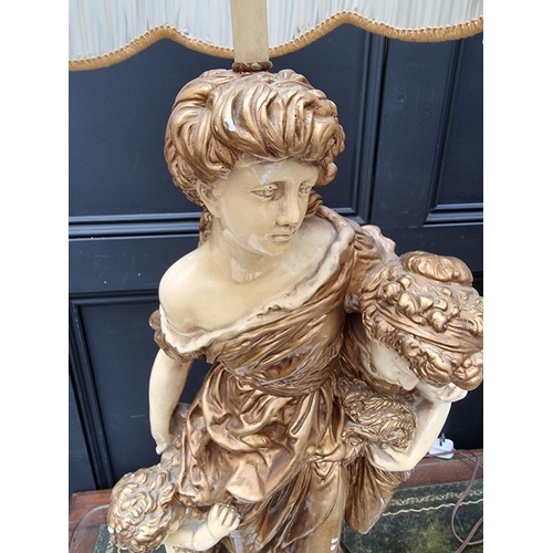 1070 - A large pair of cream and gilt painted plaster figural table lamps, height including shades 127... 