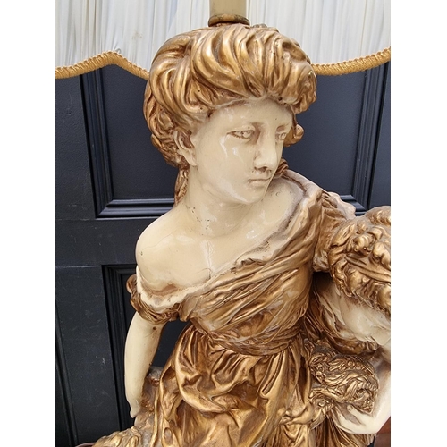 1070 - A large pair of cream and gilt painted plaster figural table lamps, height including shades 127... 