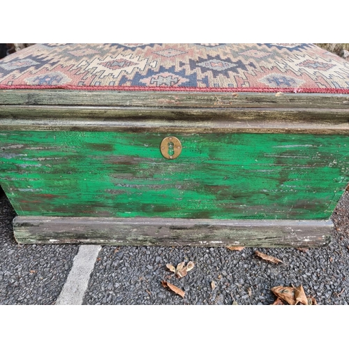 1101 - An old green painted chest, with hinged and upholstered top, 71cm wide; together with another canvas... 