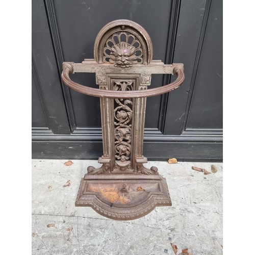 1134 - A Victorian cast iron stick stand, 71cm high.