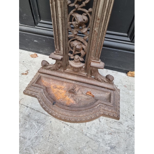 1134 - A Victorian cast iron stick stand, 71cm high.